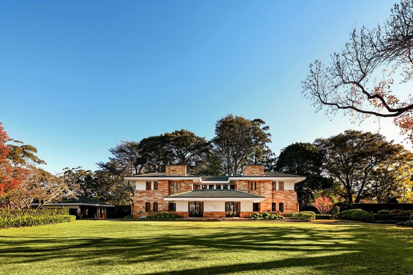 Coppins seen across the rolling lawns of the Paul Bangay gardens