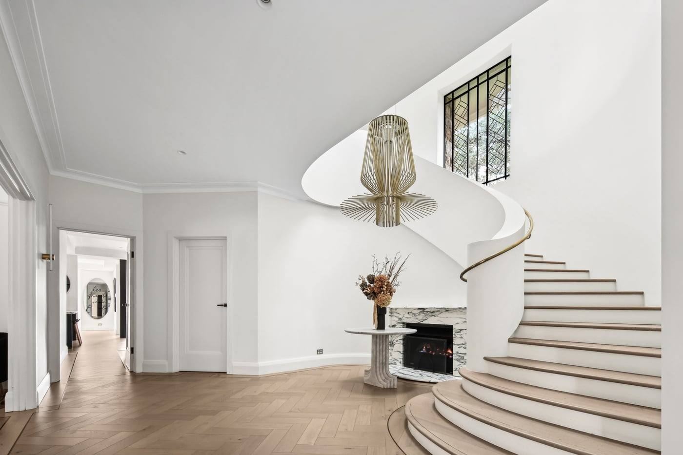 Grand foyer with sweeping handcrafted staircase
