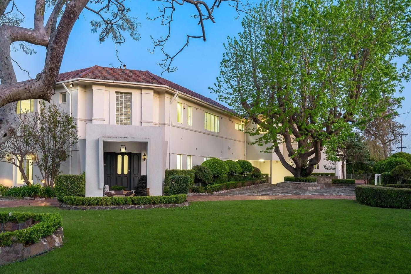 Art Deco residence at 11 Rosebery Road across the front lawn