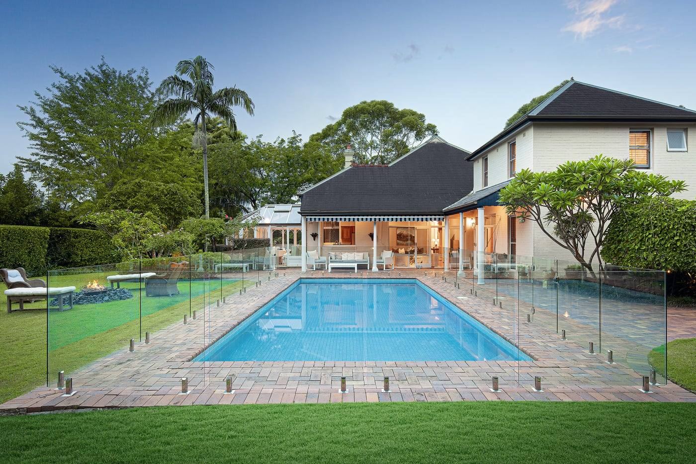 Glass-framed swimming pool and gardens at Kimberley