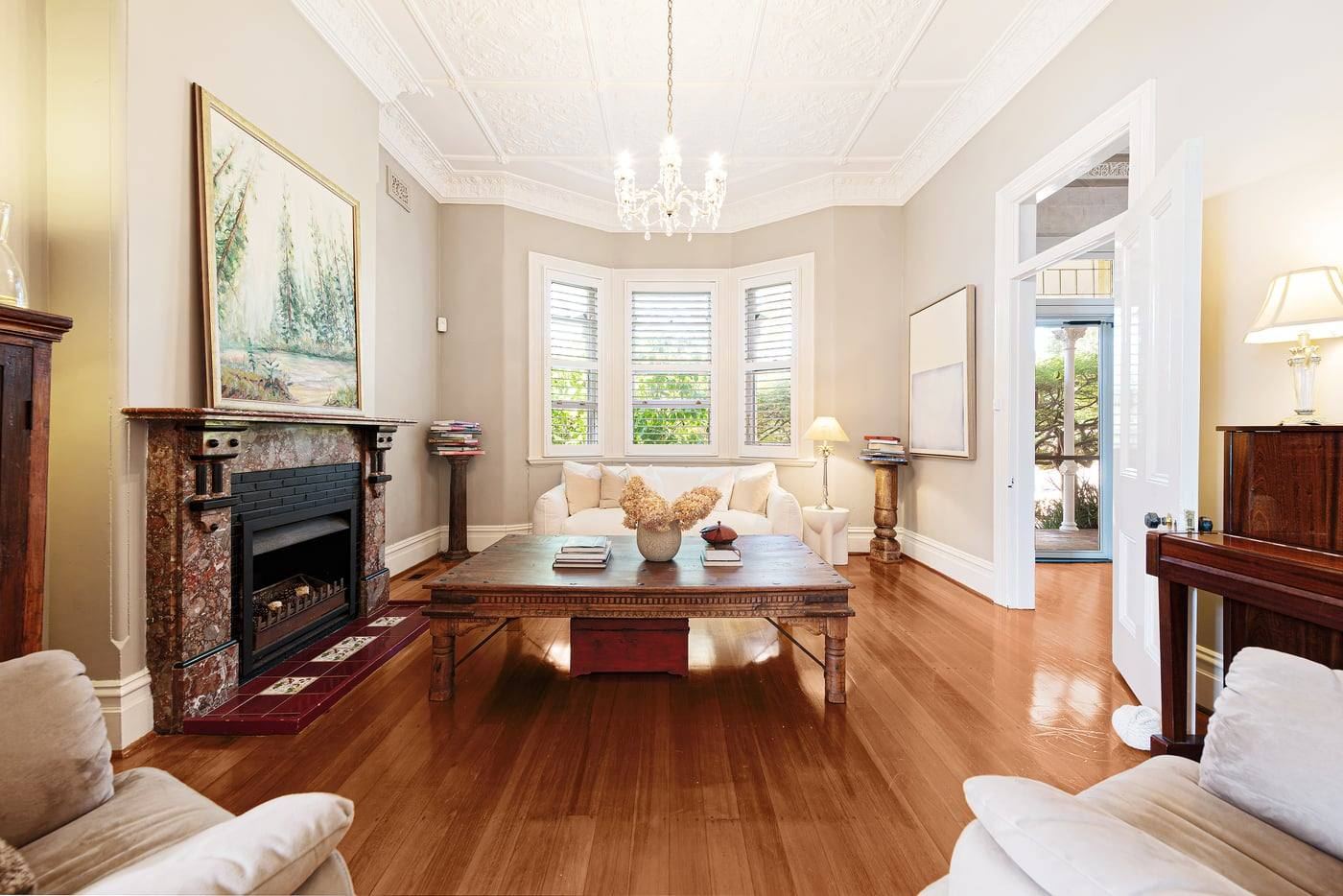 Formal lounge with marble fireplace and period ceilings